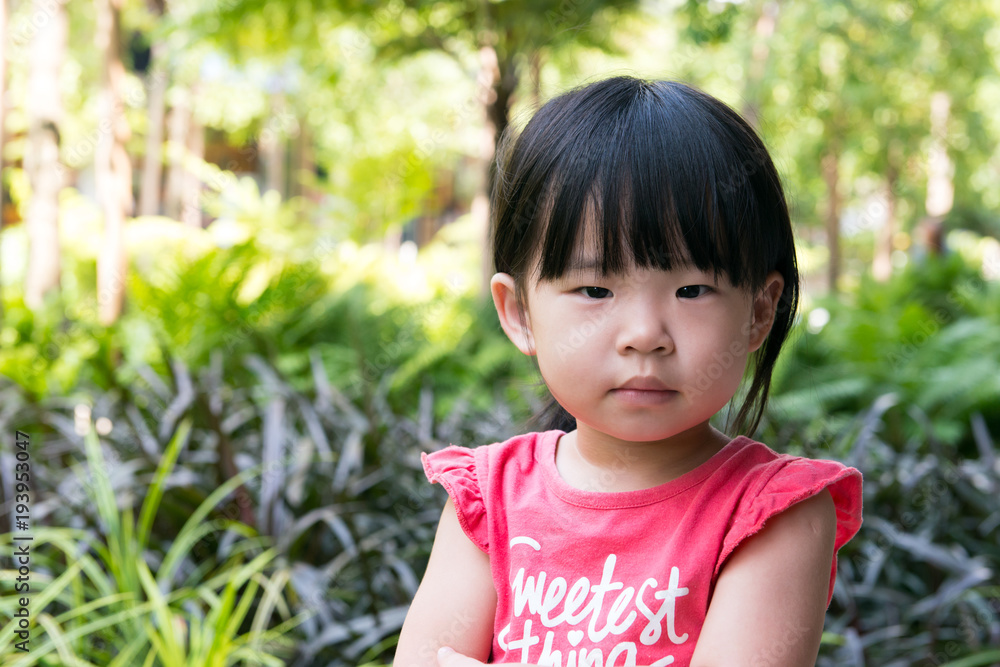 Portrait of beautiful asian child girl in outdoor park Portrait of beautiful asian child girl in outdoor park