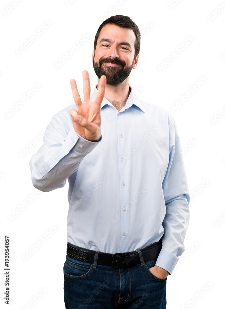 Handsome man with beard counting three Handsome man with beard counting three