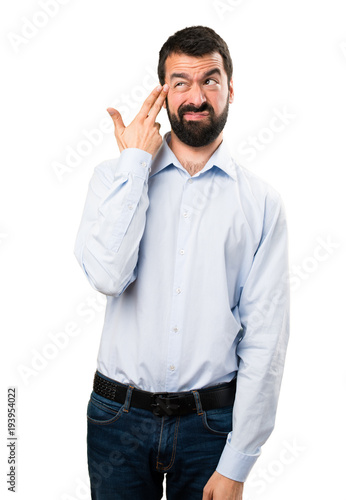 Handsome man with beard making suicide gesture