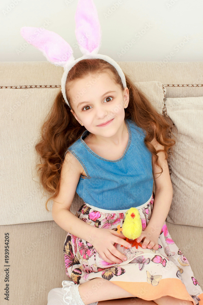 Cute little child wearing bunny ears on Easter day Cute little child wearing bunny ears on Easter day