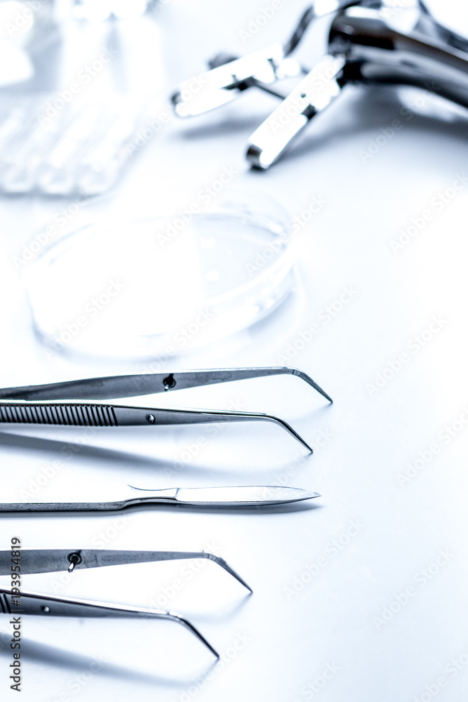 instruments of gynecologist on white background instruments of gynecologist on white background