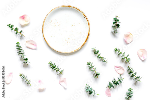 woman table with flower and herbs top view white background mock