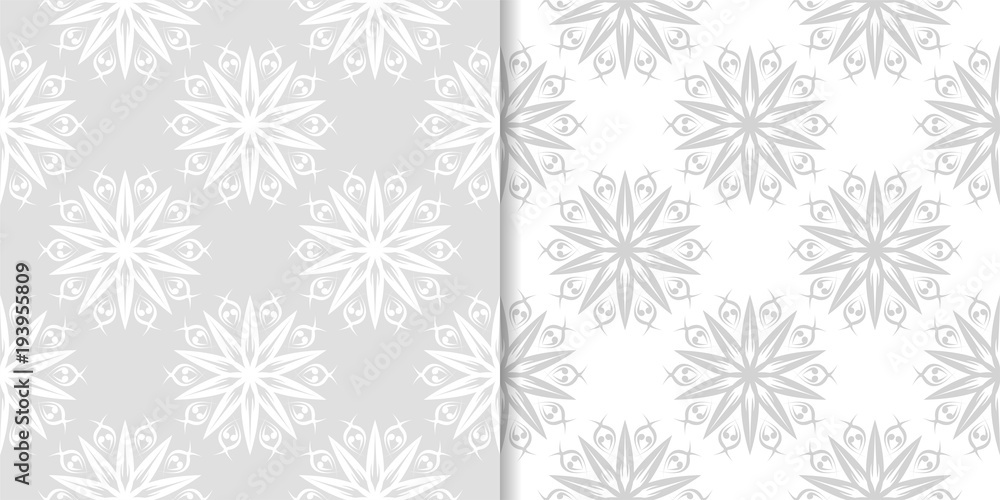 Light gray floral backgrounds. Set of seamless patterns