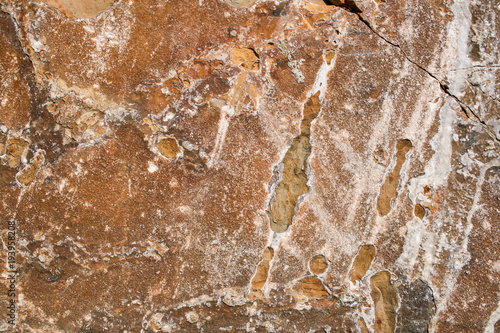 Obraz na plátně Natural stony grunge rufous background with crack and white spots