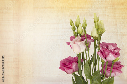 Fototapeta Naklejka Na Ścianę i Meble -  
Beautiful pink Lisianthus flower bouquet on a wooden background. with space for your text