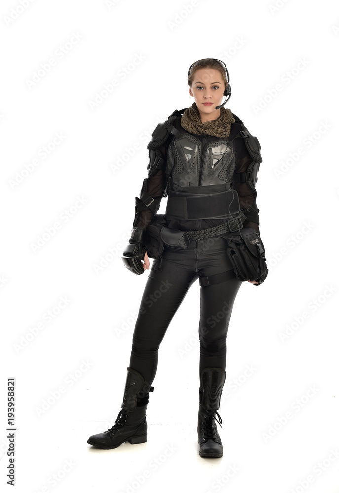 full length portrait of female soldier wearing black tactical armour, isolated on white studio background. full length portrait of female soldier wearing black tactical armour, isolated on white studio background.