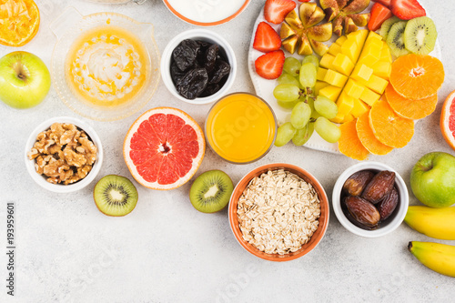 Top view of healthy breakfast with oats and fruits