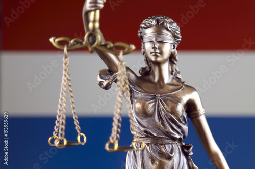Symbol of law and justice with Netherlands Flag. Close up.