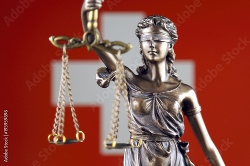 Symbol of law and justice with Switzerland Flag. Close up.