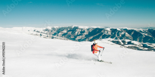 Skier woman winter mountain landscape