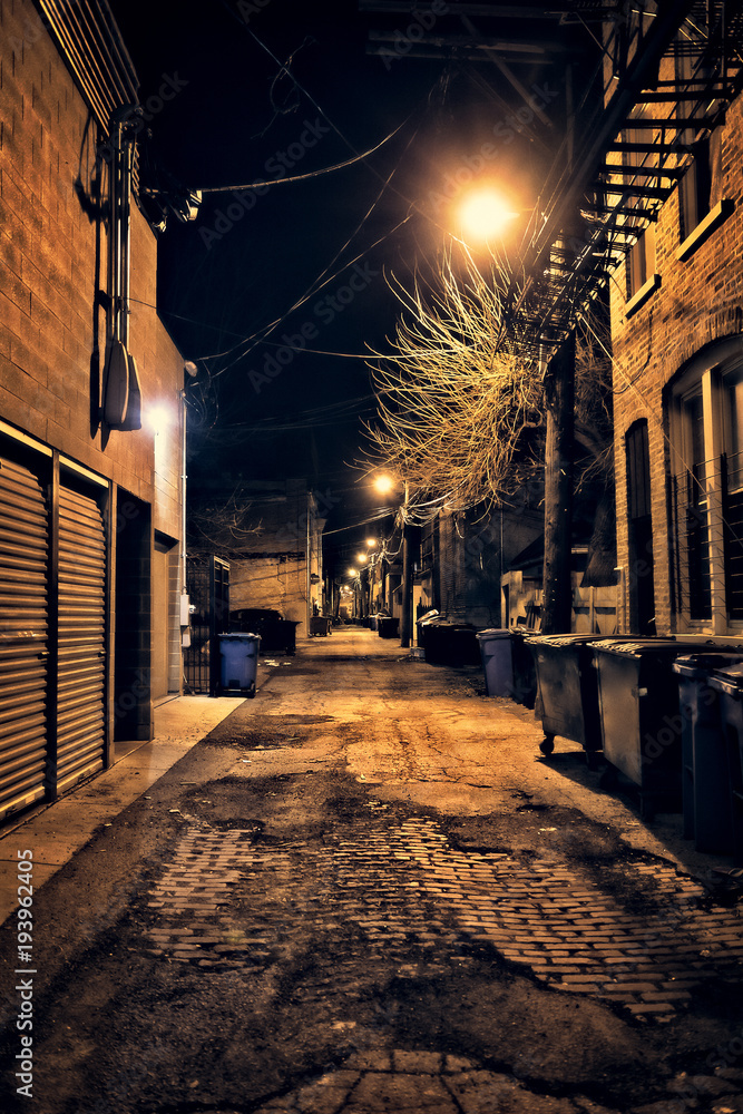 Dark empty and scary urban city street cobblestone.alley and vintage buildings at night