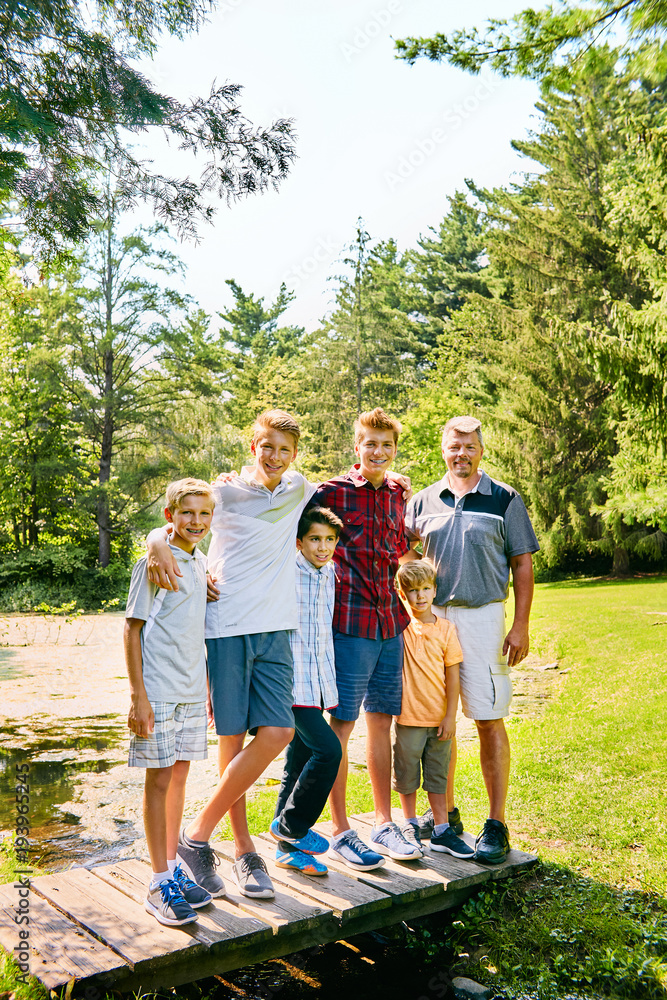Fototapeta premium Portrait of happy mature father and his five sons