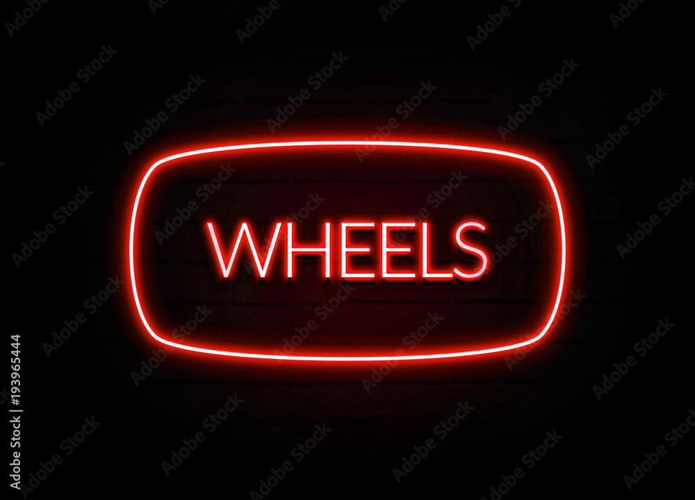 Wheels neon sign on brick wall background. Wheels neon sign on brick wall background.