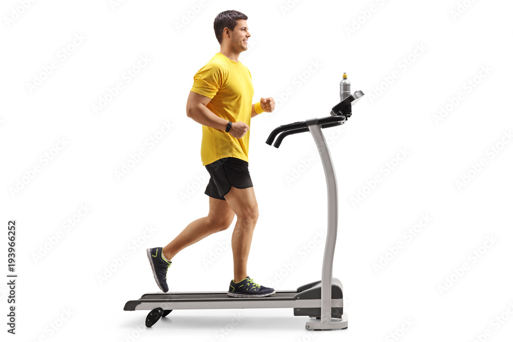 Young man running on a treadmill Young man running on a treadmill