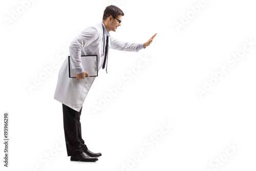 Doctor with a clipboard making a high-five gesture