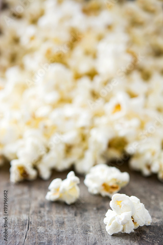 Popcorn on wooden table background. 
