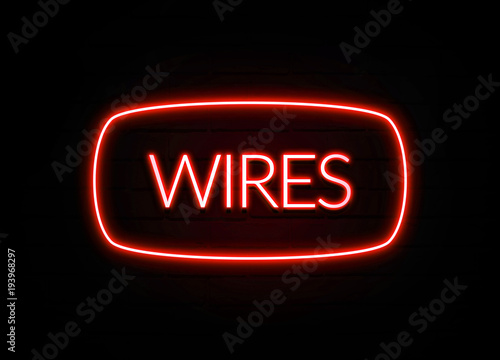 Wires neon sign on brick wall background.