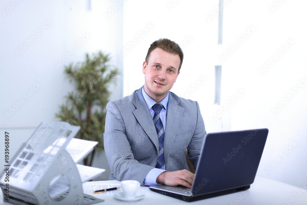 Handsome businessman is working in a office Handsome businessman is working in a office