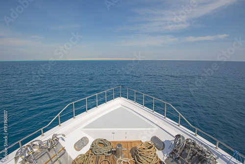Obraz na plátne View over the bow over a large luxury motor yacht