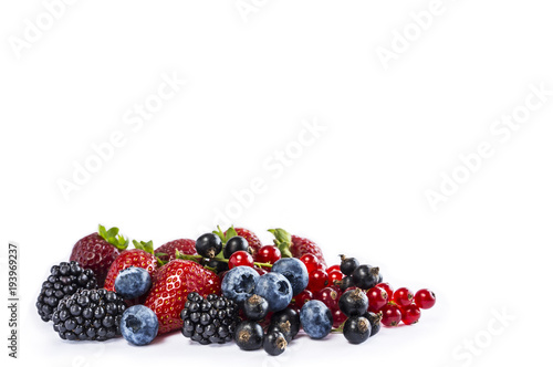 Mix berries and fruits isolated on a white. Ripe blueberries, blackberries, currants and strawberries. Berries and fruits with copy space for text. Background berries.