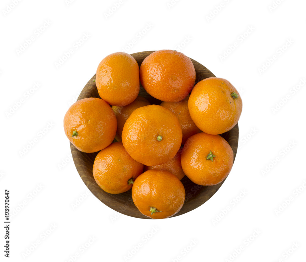 Mandarins in a wooden bowl with copy space for text. Ripe and tasty tangerines isolated on white. Clementines on a white background. Top view with copy space. Mandarins in a wooden bowl with copy space for text. Ripe and tasty tangerines isolated on white. Clementines on a white background. Top view with copy space.