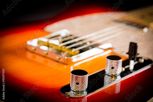 Macro Close up of a electric guitar volume and tone knobs
