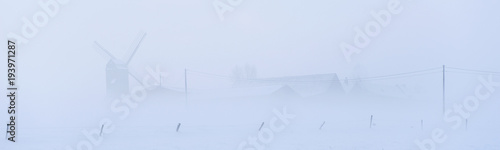Panoramic winter landscape with windmill at the Poelberg in Tielt, West-Flanders, Belgium