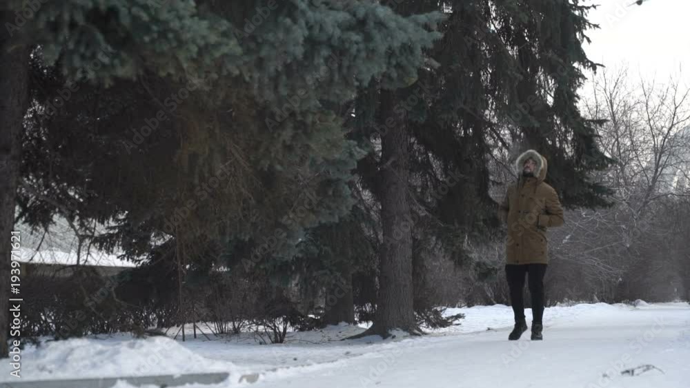 Man is walking through the forest Man is walking through the forest