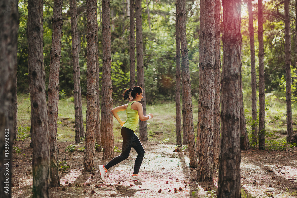 Girl running in forest Girl running in forest