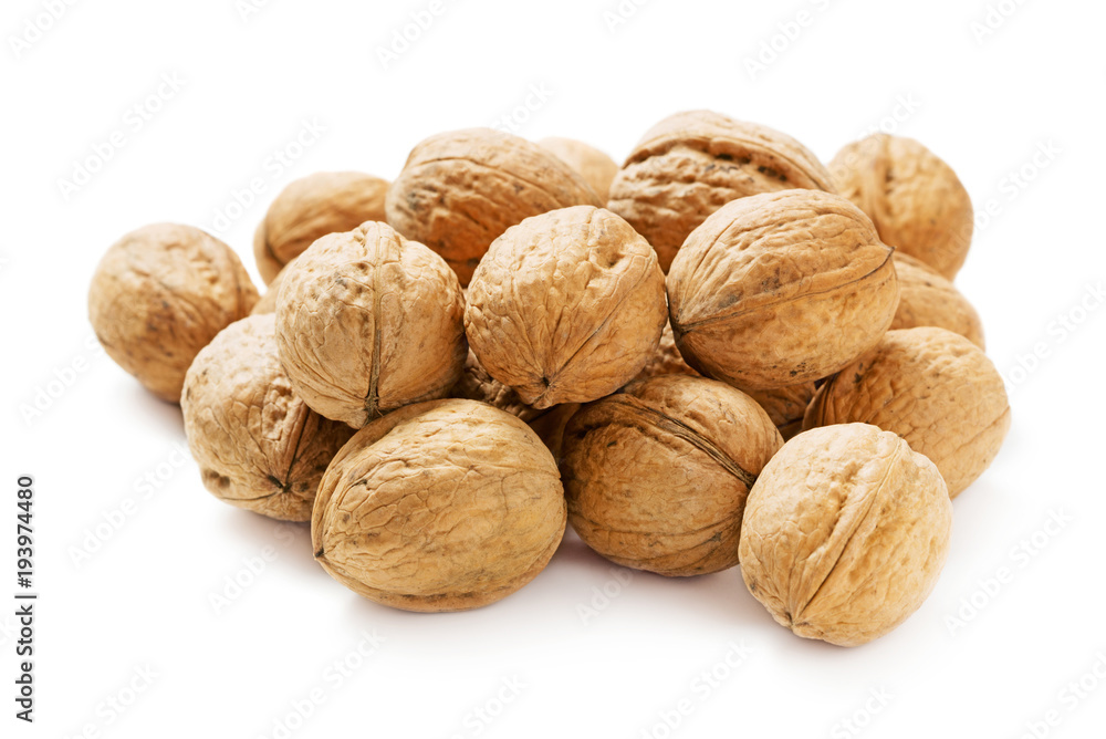 heap of walnuts in shell isolated on white background heap of walnuts in shell isolated on white background