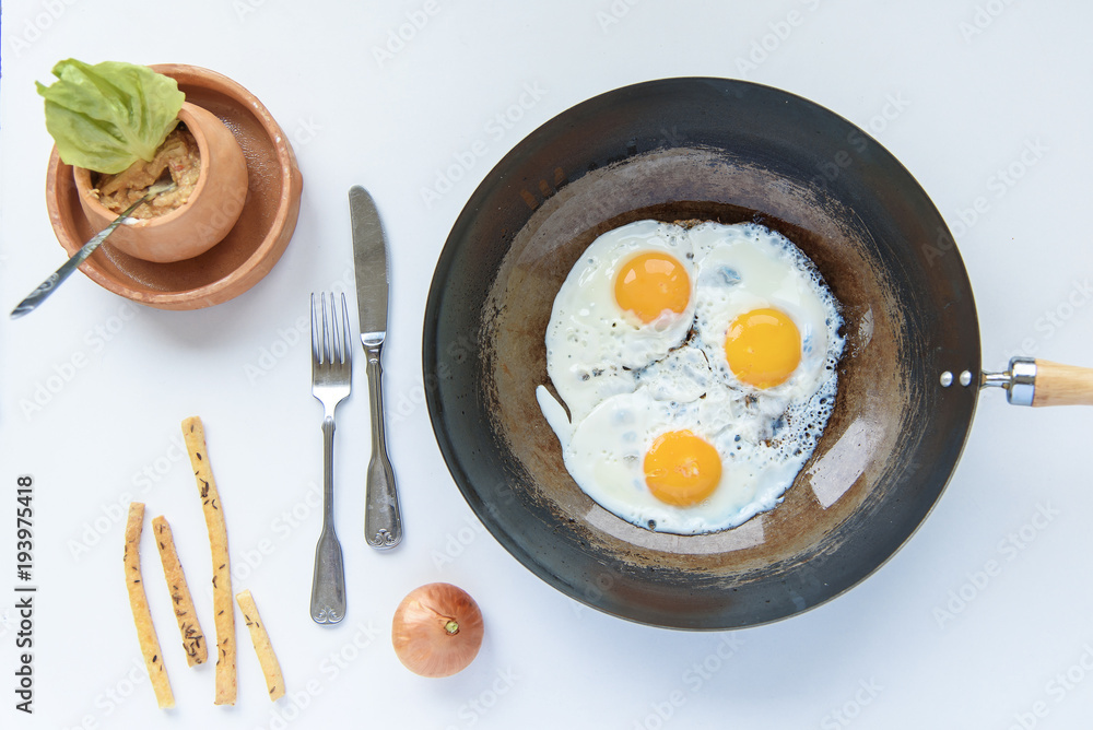 Simple morning breakfast, eggs, leek and breadsticks Simple morning breakfast, eggs, leek and breadsticks