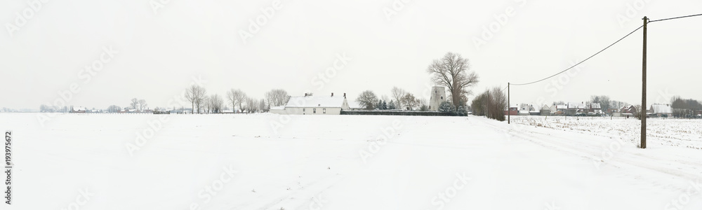Gigapano of a typical Flemish countryside landscape with farms in winter