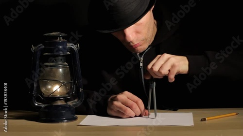 man draws a drawing