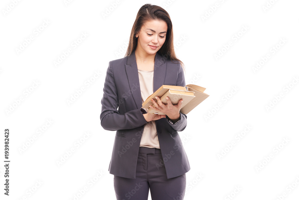Portrait of young businesswoman holding stack book Portrait of young businesswoman holding stack book