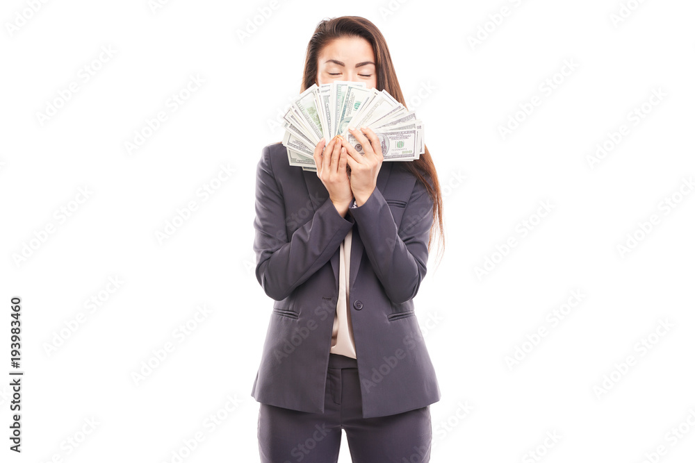 Portrait of young Asian businesswoman posing with paper currency Portrait of young Asian businesswoman posing with paper currency