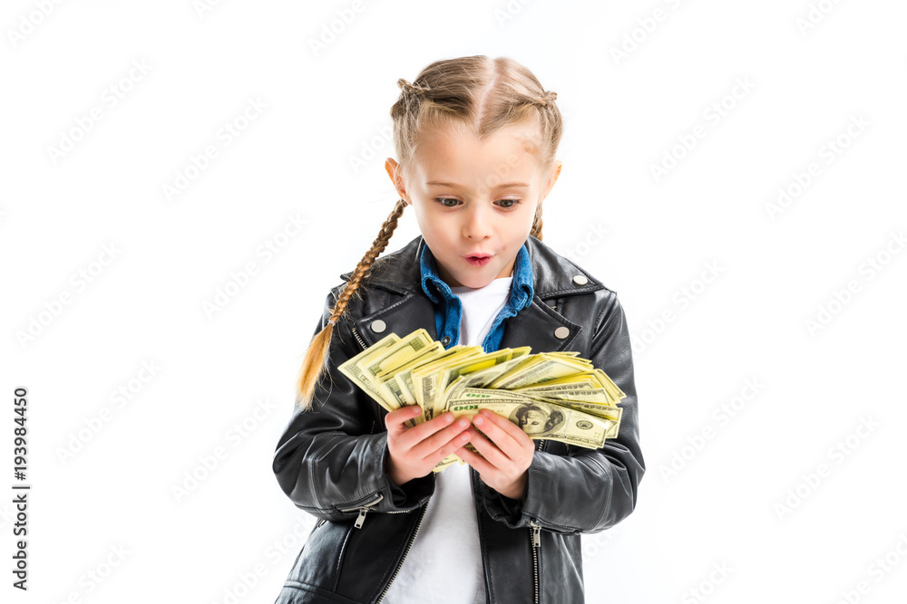 Shocked kid looking at banknotes in hands isolated on white Shocked kid looking at banknotes in hands isolated on white