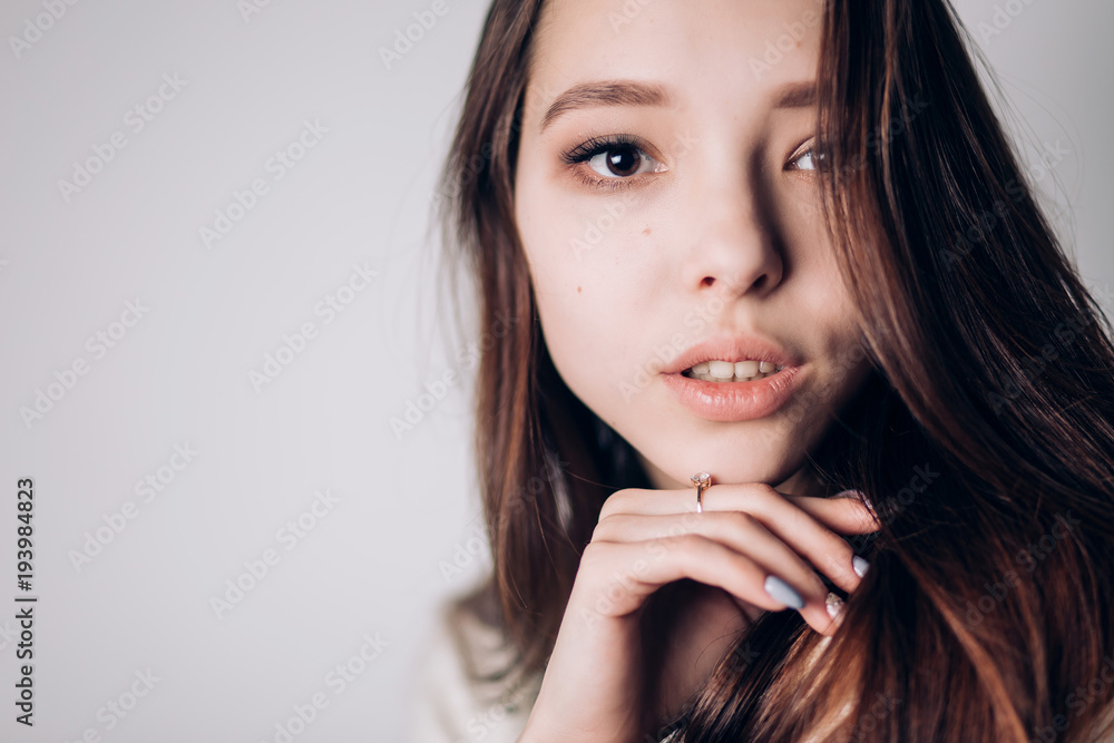 Close up portrait of beautiful young woman on white background. Horizontal, copyspace. Youth and Skin Care Close up portrait of beautiful young woman on white background. Horizontal, copyspace. Youth and Skin Care