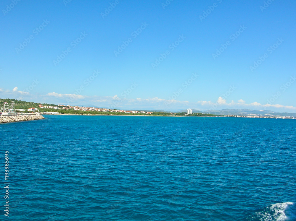 Sea surface aerial view. Background shot of clear sea water surface. Blue sea water in calm. Sea texture. Background blue waves.