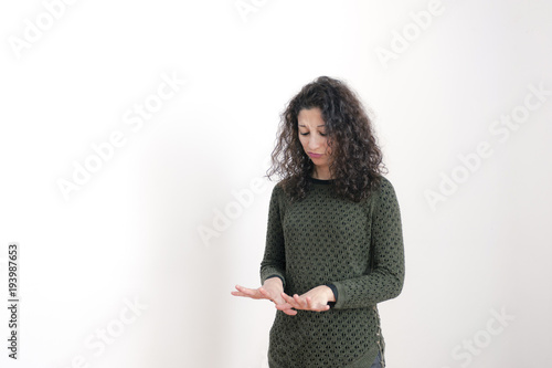 woman looking at her hands