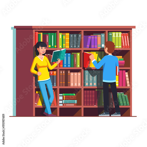 Two people standing in front of wooden bookcase