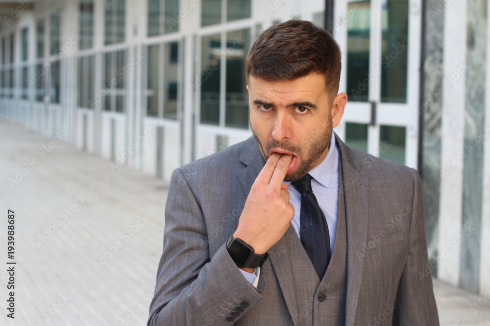Grossed out businessman about to puke Grossed out businessman about to puke