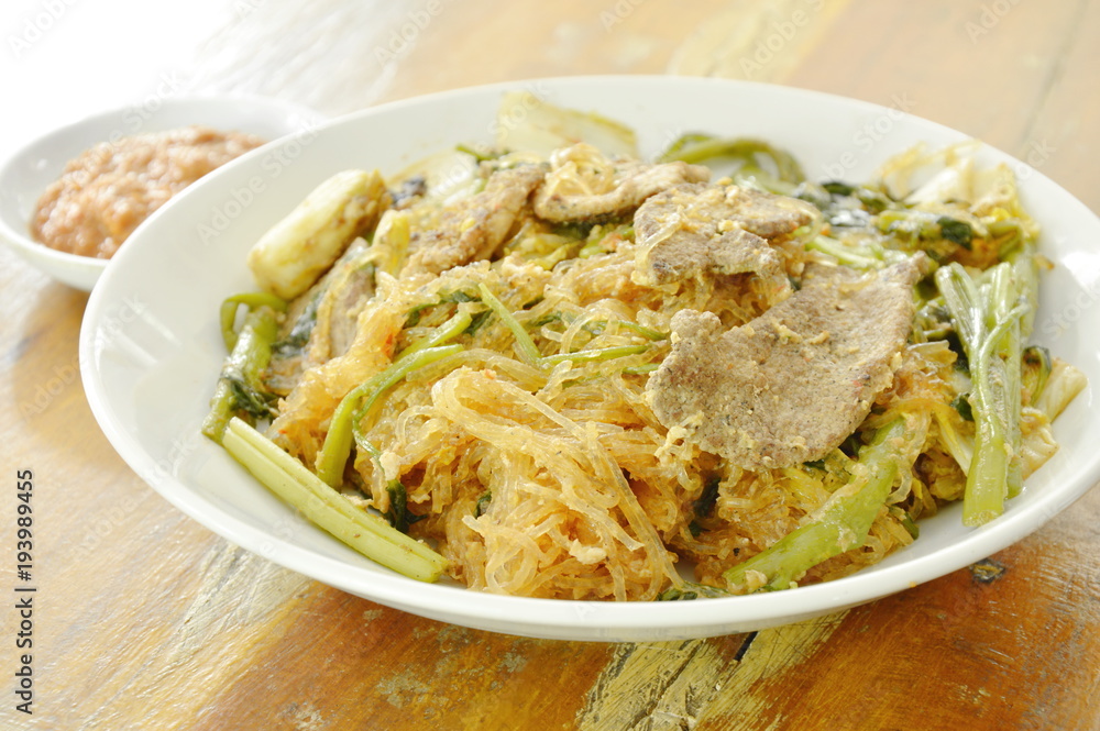 fried glass noodles with pork and vegetable on plate dipping sukiyaki sauce fried glass noodles with pork and vegetable on plate dipping sukiyaki sauce