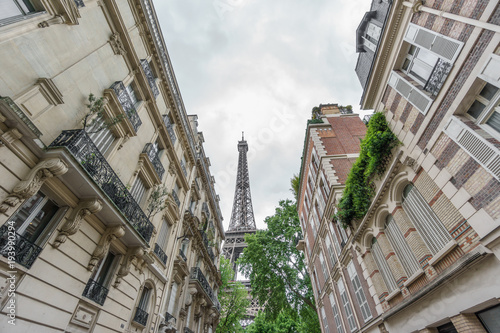 Eiffel tower behind residential buildings