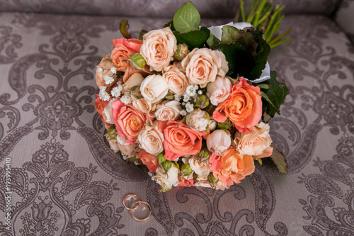 Wedding bouquet of orange and white roses