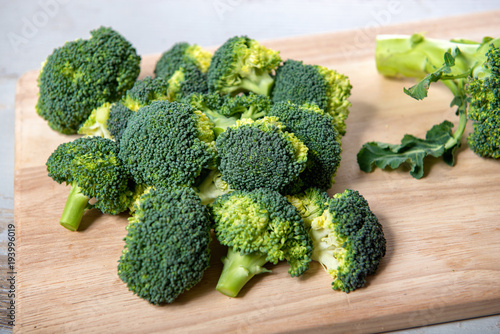 tasty broccoli on wooden board