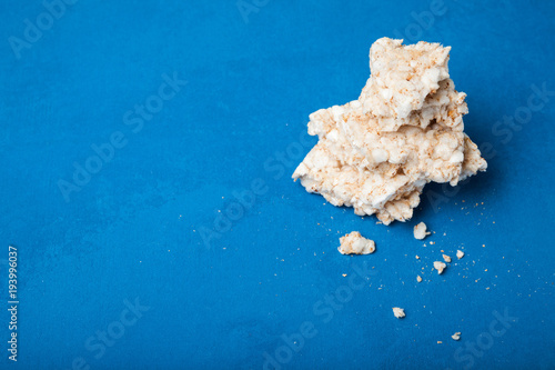 Pieces of rice bread on a blue background.