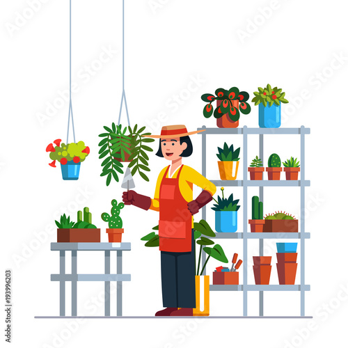 Woman gardener working in botanical garden