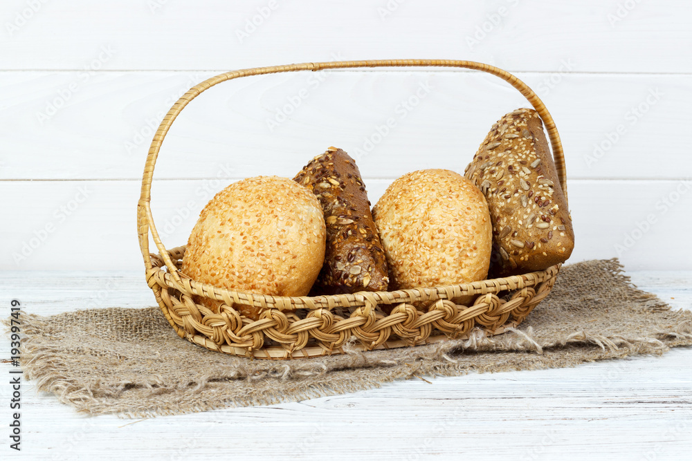 Composition with variety of buns baking products on wooden table