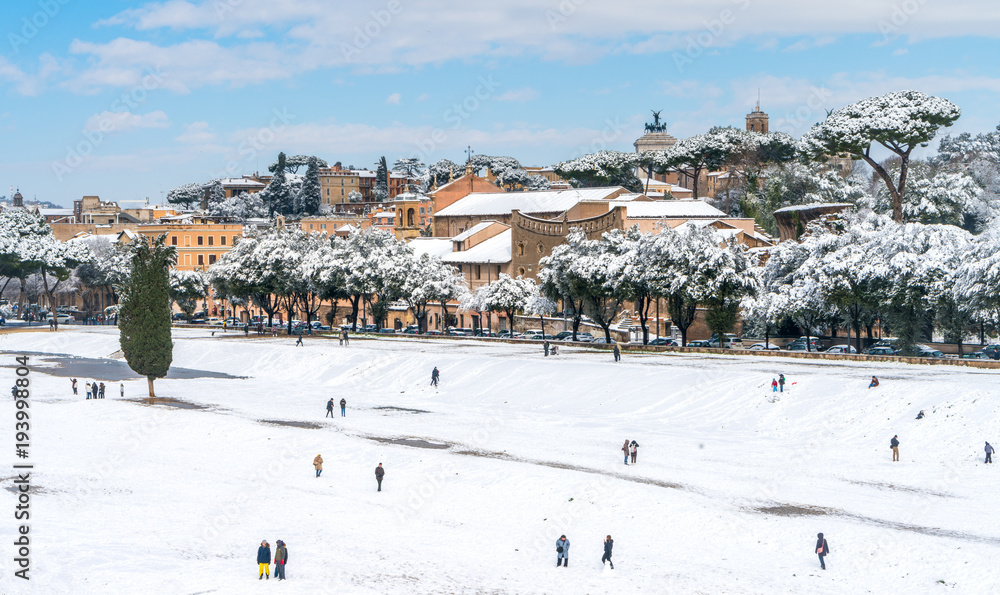 Snow in Rome, people playing at the Circo Massimo
