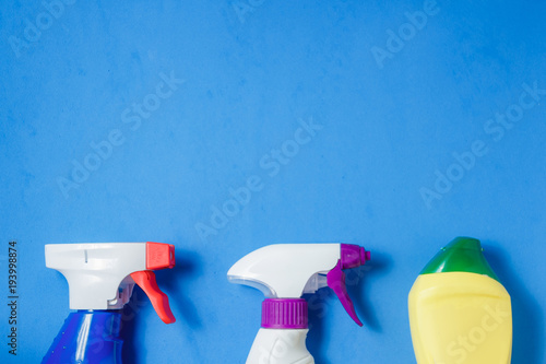 Cleaning Products. Home Cleaning Concept. Blue Background. Place for Typography and Logo. Copy space. Flat Lay Top View